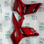 قاب (کاور) بغل انجین موتور TVS راکس جدید انژکتوری مشکی قرمز اصلی (جفتی)